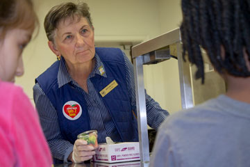 Vice Mayor Mary Jane Dolan serving students lunches