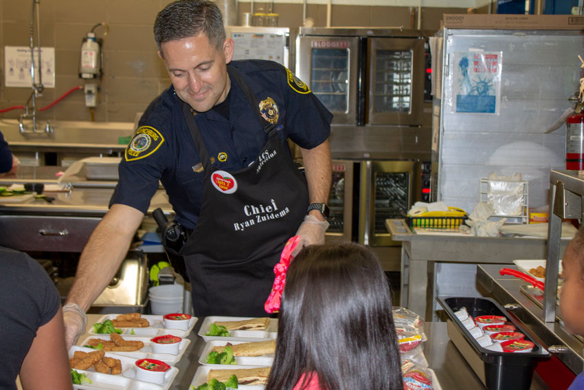 Police Chief Zuidema serving students lunch