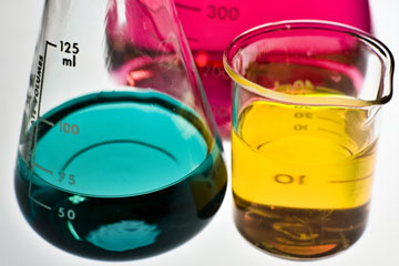 Lab glassware filled with colorful liquids