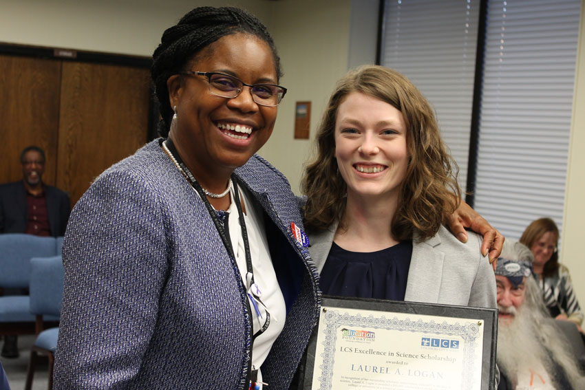 Dr. Edwards with Laurel Logan holding LCS Excellence in Science Scholarship award