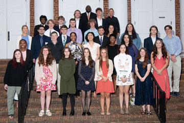 Group of senior honors recipients standing on stairs