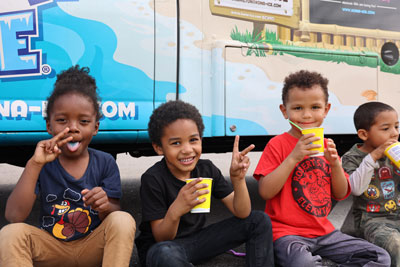 Students eating ice treats outside