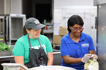 Brigaid program chef Hannah Breig with LCS school nutrition worker