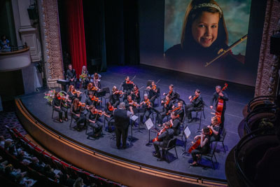 Alumni orchestra performing at Academy Center of the Arts