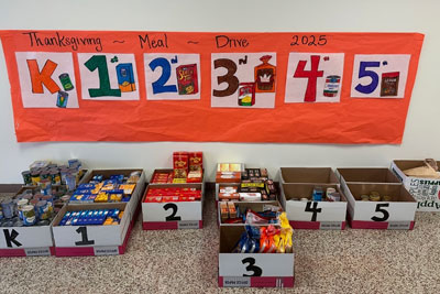 Thanksgiving Meal Drive 2025 boxes labeled K, 1, 2, 3, 4, 5