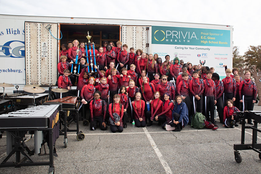 Marching band holding trophy at competition