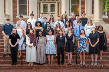 Group of senior honors recipients standing on stairs