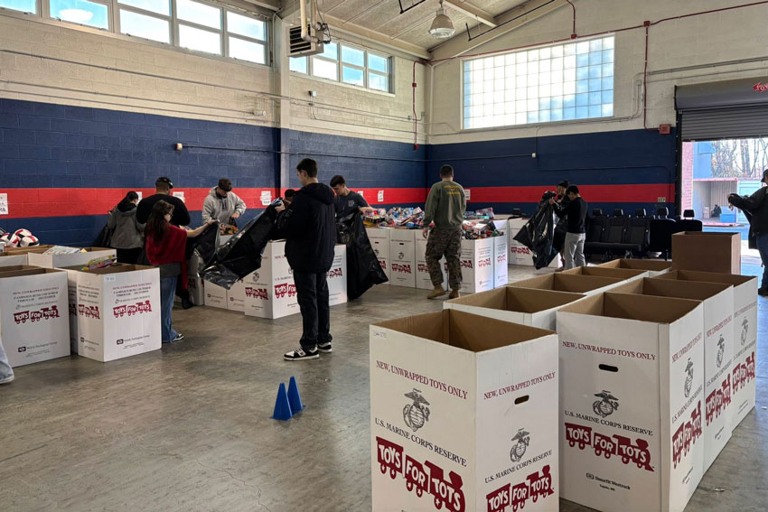 Students sorting Toys for Tots donations
