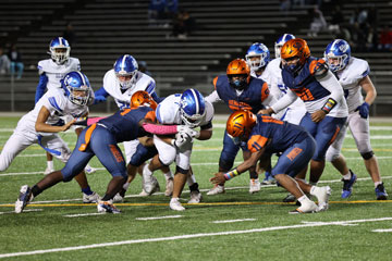 E. C. Glass and Heritage players during football game