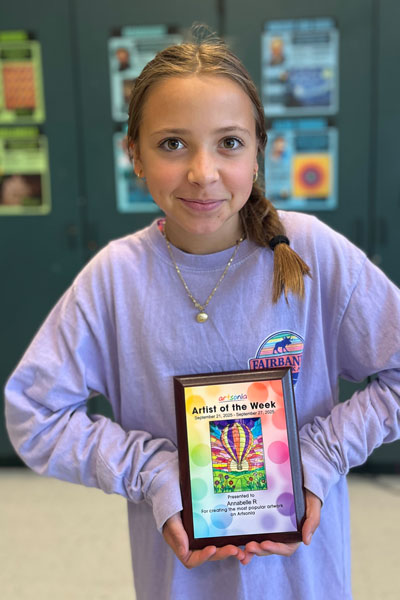 Annie Richards holding national Artist of the Week award