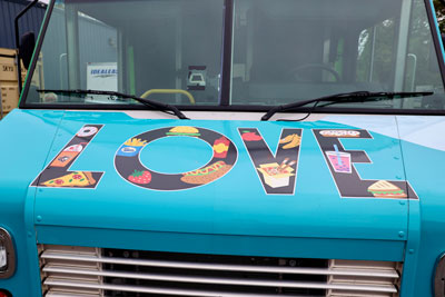 Front of food truck with "LOVE" graphic