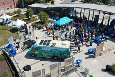 Aerial view of food truck launch event at city stadium