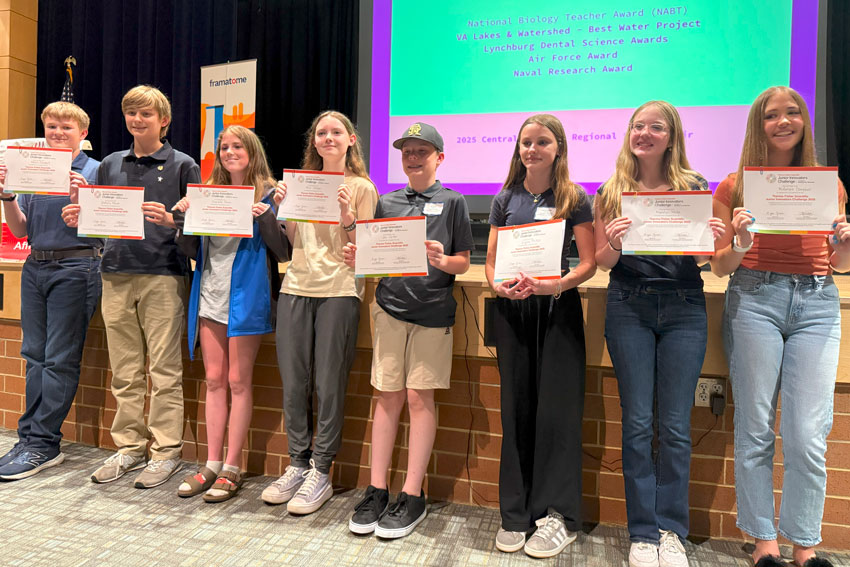 Eight middle school students holding certificates