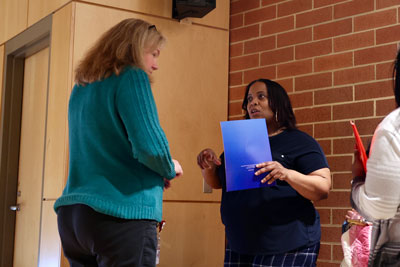 HR staff speaking with new teacher