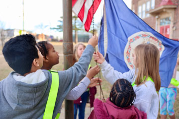 R. S. Payne Elementary students raise the American and Virginian flags