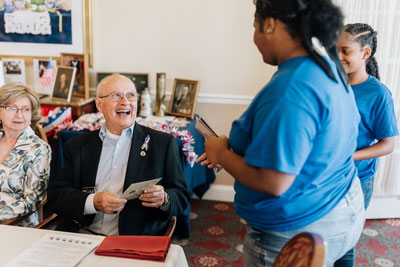 Middle school students with members of senior living community
