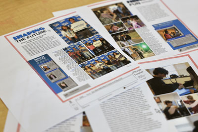 Yearbook spreads scattered on table