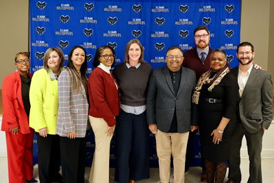 Teacher of the Year surrounded by a group of school administrators