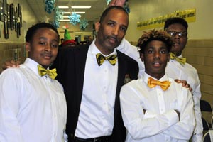 Man and three students in bow ties