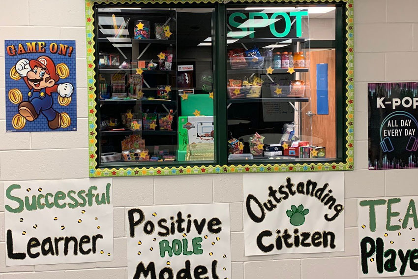 PBIS rewards display with posters describing program