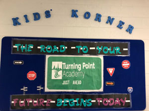 Turning Point Academy bulletin board with writing "Kids Korner The Road to Your Future Begins Today"