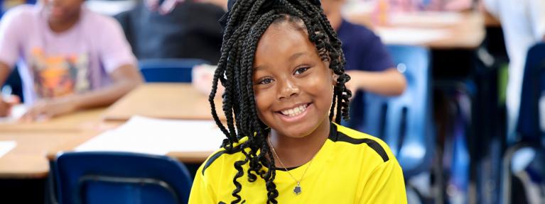 Girl smiling in classroom