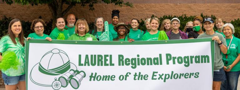 LAUREL staff holding banner