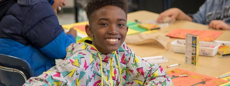 Boy smiling in art class
