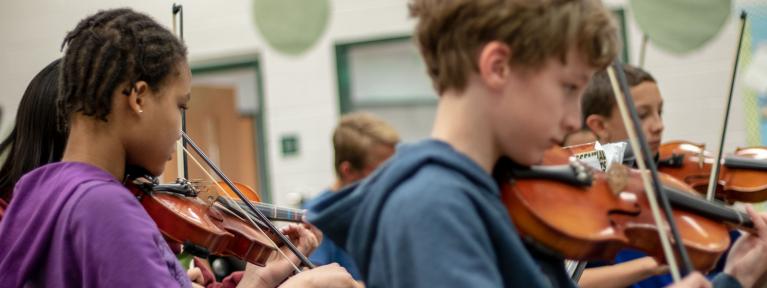 Students playing violins