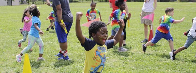 Boy running outside during field day