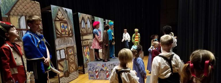 Kids in costume on stage