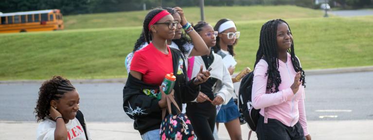 Group of students walking into school