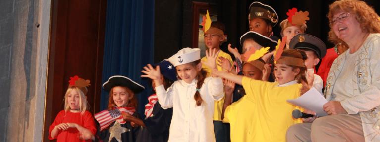 Students on stage during play performance